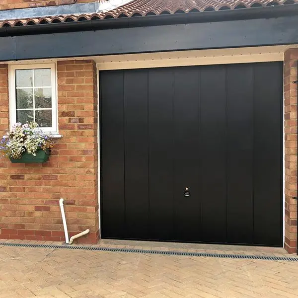 Garador Windsor steel up-and-over garage door in a classic finish with vertical ribbed panels