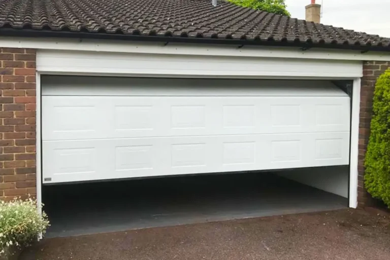 Sectional garage door with automation showing a complete installation with electric opener