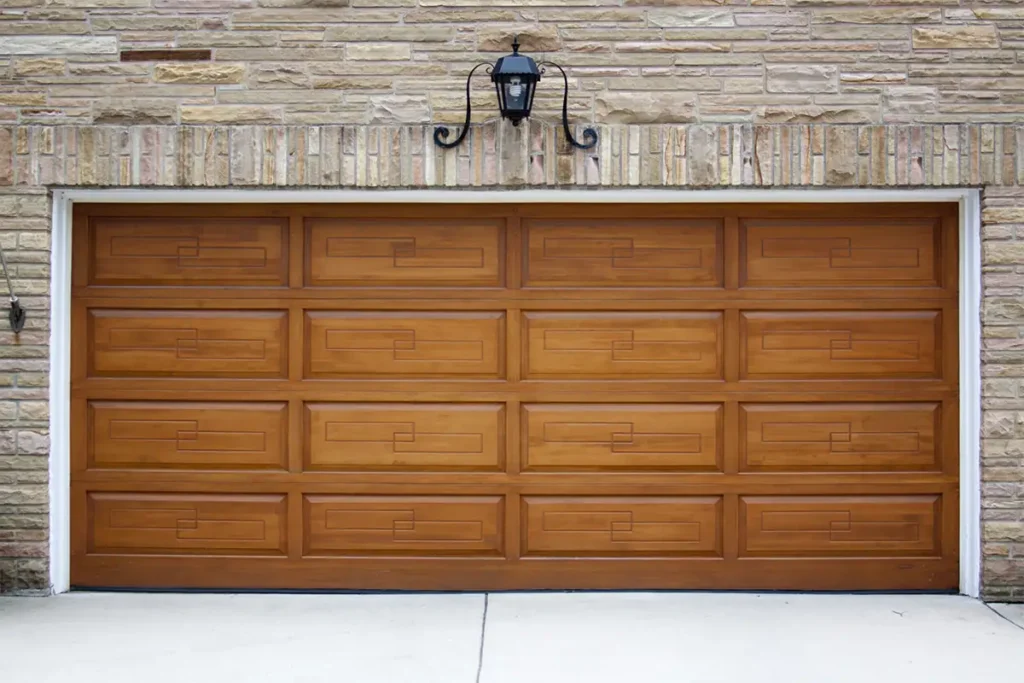 Premium timber sectional garage door with unique on a residential property featuring natural wood grain and contemporary styling