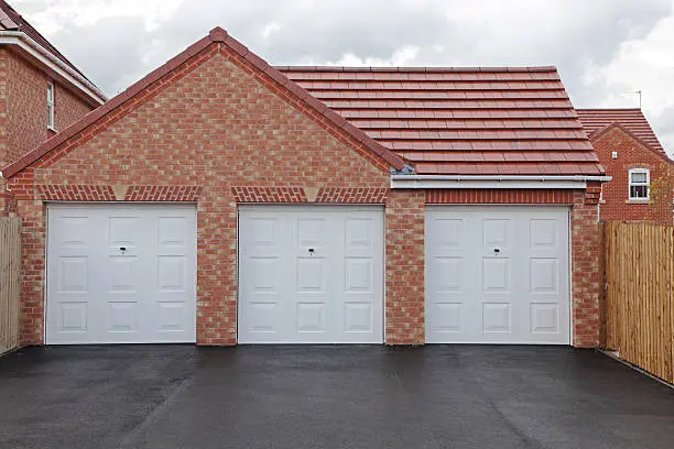 Triple up-and-over garage door on a residential property